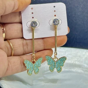 A pair of drop earrings with a small, golden butterfly charm with a delicate green enamel finish.