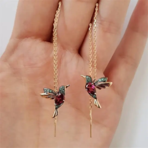 A pair of whimsical drop earrings with a small, beautifully detailed hummingbird charm.