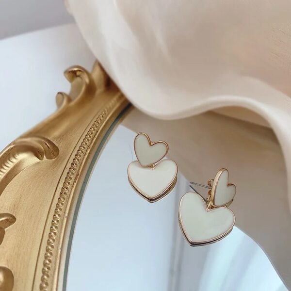 white heart dangler earrings - Image 3
